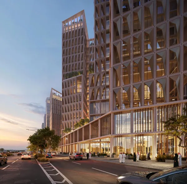 North View — the ground-floor colonnade and the tower façade at dusk, Riyadh